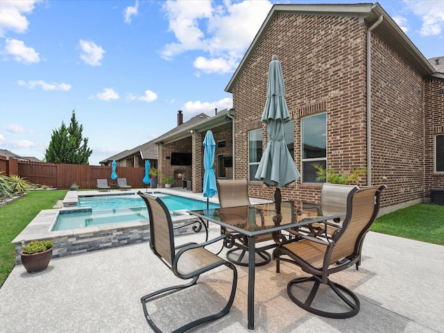 10814 Avery Arbor Ln, Cypress, TX 77433 - fenced backyard with a patio, outdoor dining area, and a pool with connected hot tub