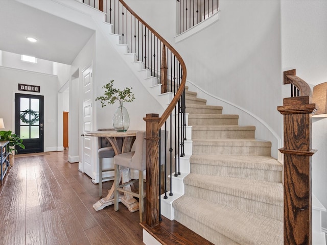 10814 Avery Arbor Ln, Cypress, TX 77433 - entryway featuring stairs, wood-type flooring, and a towering ceiling