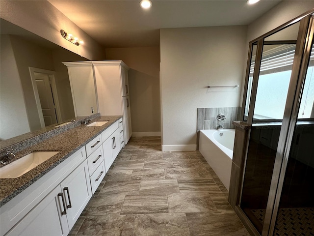 4301 Clover St, Houston, TX 77051 - bathroom with double vanity, a garden tub, recessed lighting, and a shower stall