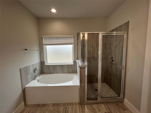 4301 Clover St, Houston, TX 77051 - full bathroom with a bath, a stall shower, and wood finished floors