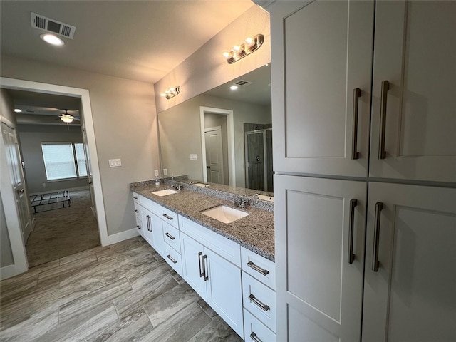 4301 Clover St, Houston, TX 77051 - full bath with double vanity, a stall shower, and a ceiling fan
