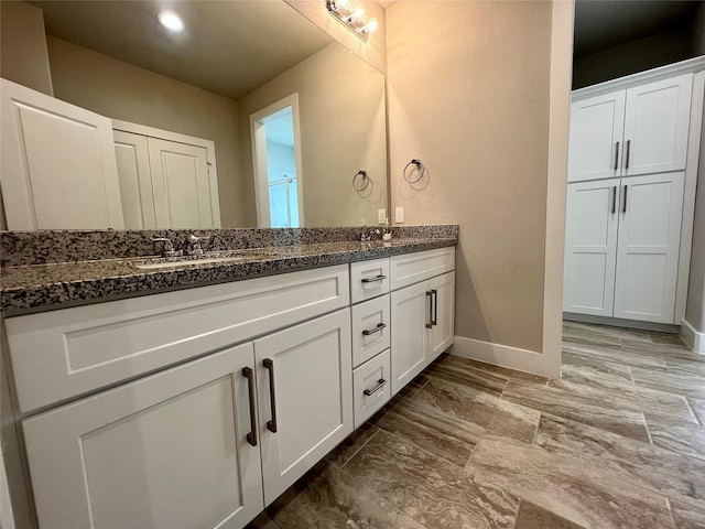 4301 Clover St, Houston, TX 77051 - full bathroom featuring double vanity and baseboards