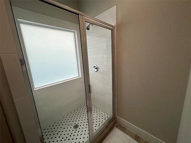 4301 Clover St, Houston, TX 77051 - bathroom featuring a shower stall and baseboards