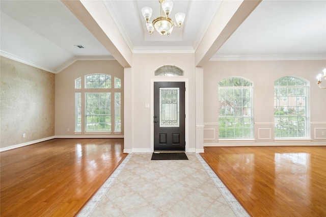 3102 Stargate Ct, Houston, TX 77068 - entryway featuring a chandelier, wood finished floors, and ornamental molding