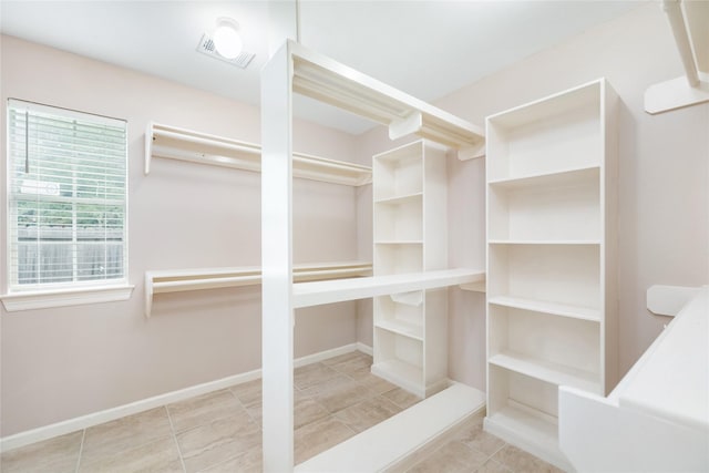 3102 Stargate Ct, Houston, TX 77068 - walk in closet featuring tile patterned floors