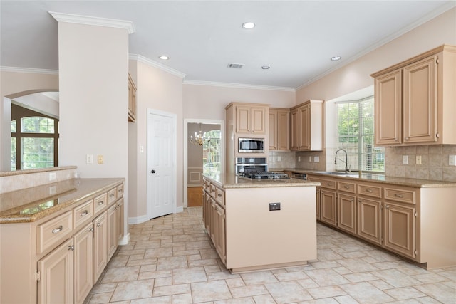 3102 Stargate Ct, Houston, TX 77068 - kitchen featuring light stone finish flooring, a center island, stainless steel microwave, arched walkways, and backsplash