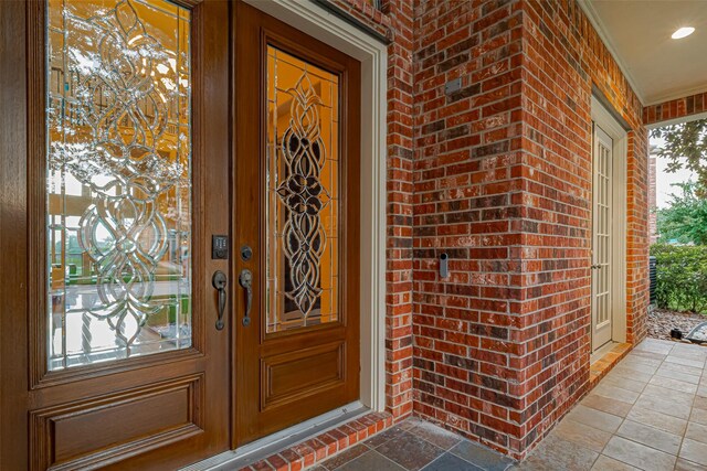8707 Crossriver Ln, Houston, TX 77095 - property entrance featuring brick siding and a porch