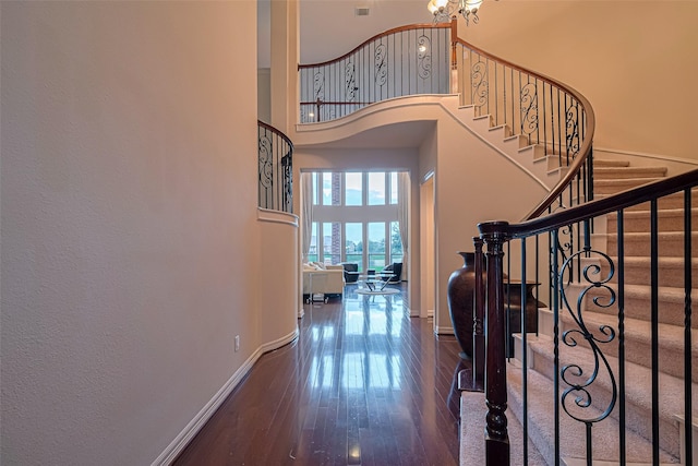 8707 Crossriver Ln, Houston, TX 77095 - entryway featuring wood finished floors, stairs, and a towering ceiling