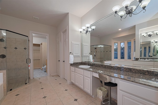 8707 Crossriver Ln, Houston, TX 77095 - full bathroom featuring a chandelier, a shower stall, vanity, and tile patterned flooring