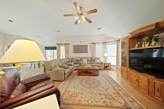 1512 Pine Ridge Ln, Pearland, TX 77581 - living room featuring a ceiling fan, light wood-type flooring, and vaulted ceiling