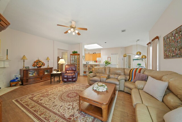 1512 Pine Ridge Ln, Pearland, TX 77581 - living room with a ceiling fan and light wood finished floors