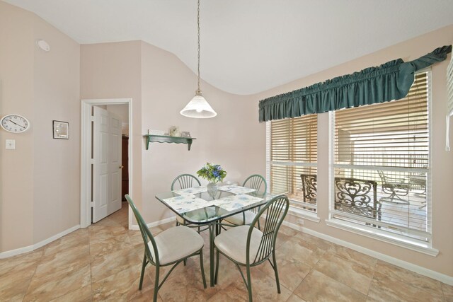 1512 Pine Ridge Ln, Pearland, TX 77581 - dining space with lofted ceiling and baseboards