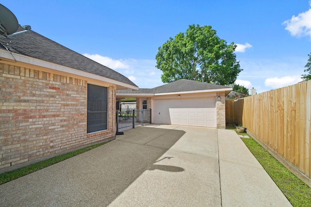 1512 Pine Ridge Ln, Pearland, TX 77581 - view of patio / terrace featuring a gate and a detached garage