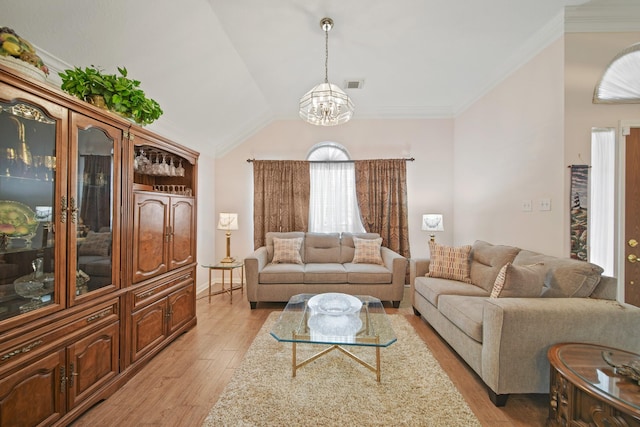1512 Pine Ridge Ln, Pearland, TX 77581 - living room with a chandelier, light wood-style floors, ornamental molding, and vaulted ceiling