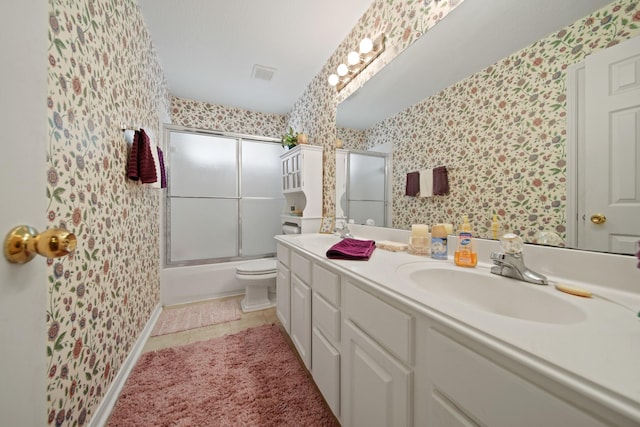 1512 Pine Ridge Ln, Pearland, TX 77581 - full bath with wallpapered walls, double vanity, shower / bath combination with glass door, and tile patterned floors