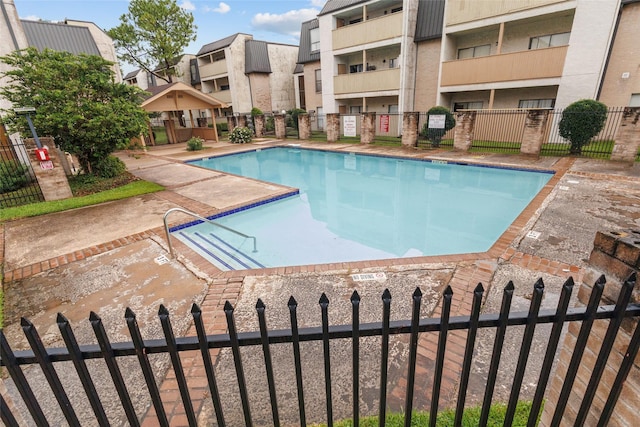 8423 Hearth Dr Unit 26, Houston, TX 77054 - community pool featuring a residential view