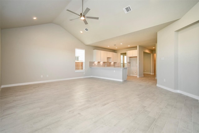 11110 Crocus Dr, Houston, TX 77044 - unfurnished living room with vaulted ceiling, ceiling fan, recessed lighting, and light wood finished floors