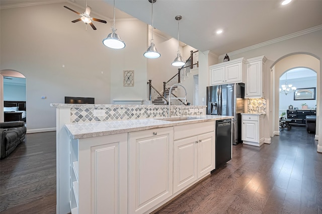 19415 Maifest Dr, Cypress, TX 77433 - kitchen with arched walkways, dishwasher, a ceiling fan, dark wood finished floors, and ornamental molding