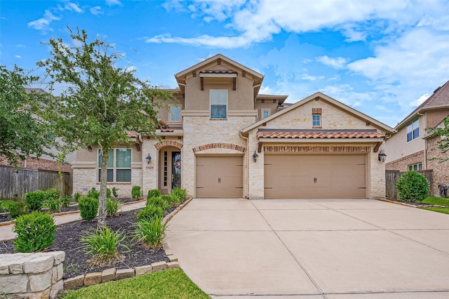 19415 Maifest Dr, Cypress, TX 77433 - mediterranean / spanish-style house with driveway, stone siding, stucco siding, and an attached garage