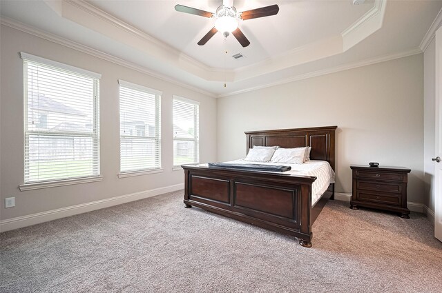 19415 Maifest Dr, Cypress, TX 77433 - bedroom with a tray ceiling, light colored carpet, ornamental molding, and a ceiling fan