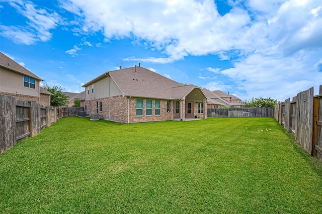 19415 Maifest Dr, Cypress, TX 77433 - rear view of property with brick siding, a fenced backyard, a patio area, and a shingled roof