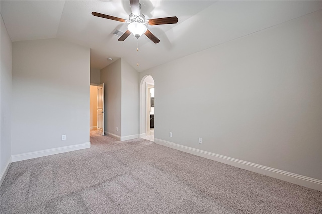 19415 Maifest Dr, Cypress, TX 77433 - spare room with lofted ceiling, arched walkways, a ceiling fan, and light colored carpet