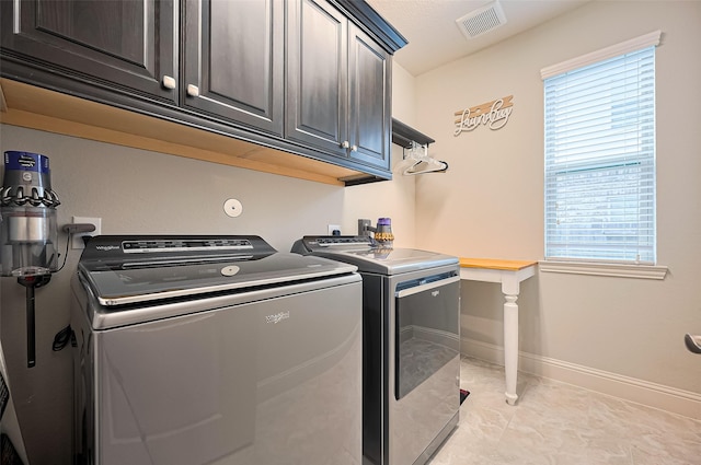 19415 Maifest Dr, Cypress, TX 77433 - washroom featuring separate washer and dryer, cabinet space, and healthy amount of natural light
