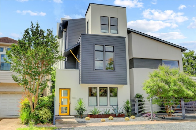 5007 Dickson St, Houston, TX 77007 - modern home with stucco siding and a garage