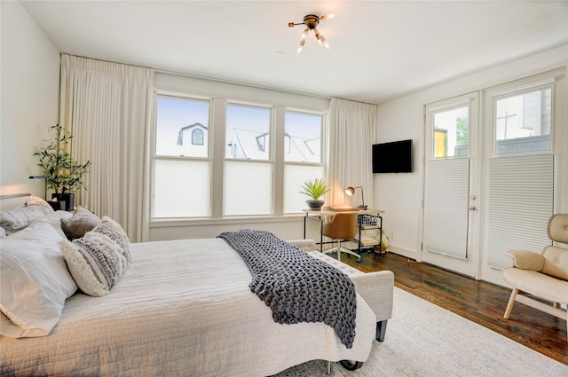 5007 Dickson St, Houston, TX 77007 - bedroom featuring multiple windows and dark wood-style floors