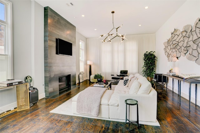 5007 Dickson St, Houston, TX 77007 - living room with a chandelier, plenty of natural light, wood finished floors, recessed lighting, and a fireplace