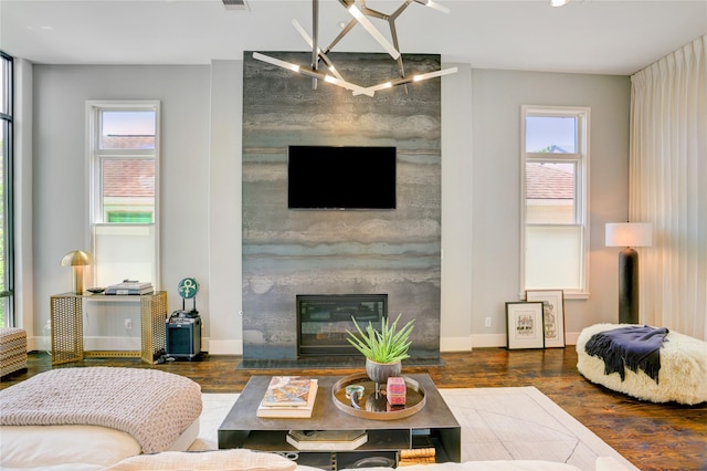 5007 Dickson St, Houston, TX 77007 - living room featuring wood finished floors, a high end fireplace, and recessed lighting