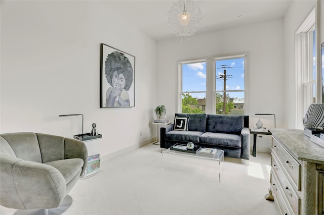 5007 Dickson St, Houston, TX 77007 - carpeted living room with a chandelier and baseboards
