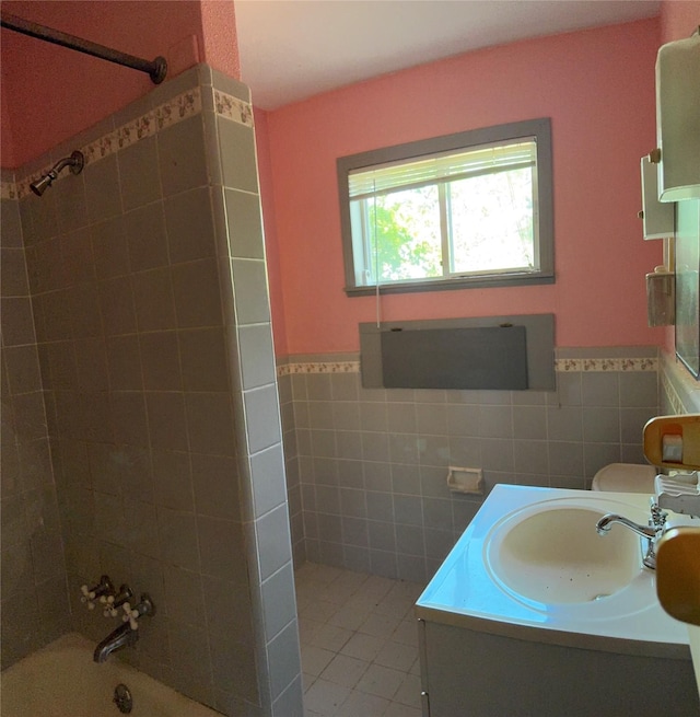 3120 Cemetery Rd, Santa Fe, TX 77517 - full bath with tile walls, wainscoting, tile patterned flooring,  shower combination, and vanity