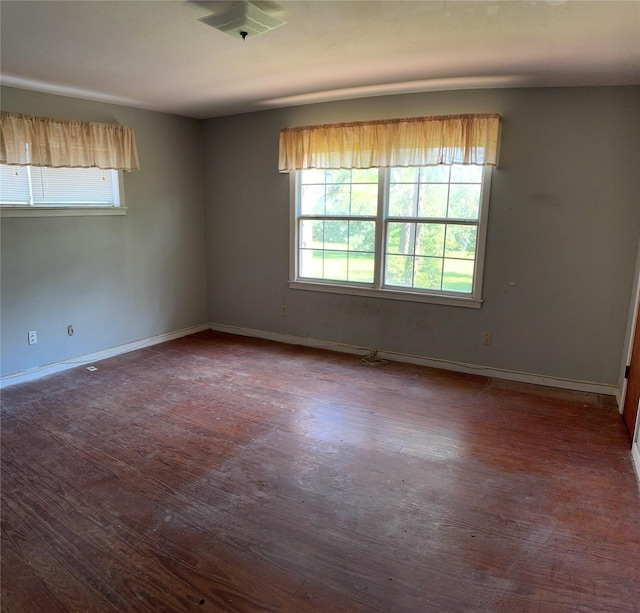 3120 Cemetery Rd, Santa Fe, TX 77517 - empty room featuring healthy amount of natural light and dark wood-type flooring