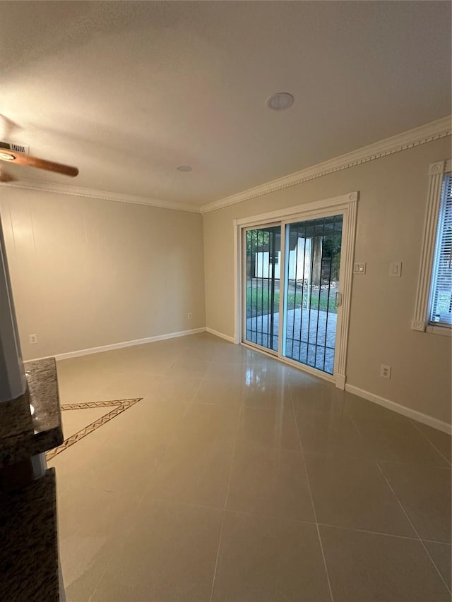 1307 Rim Rock Dr, Houston, TX 77088 - tiled spare room featuring ornamental molding and a ceiling fan
