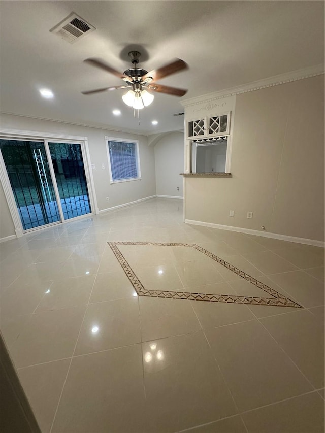 1307 Rim Rock Dr, Houston, TX 77088 - unfurnished living room featuring ceiling fan, ornamental molding, and light tile patterned floors