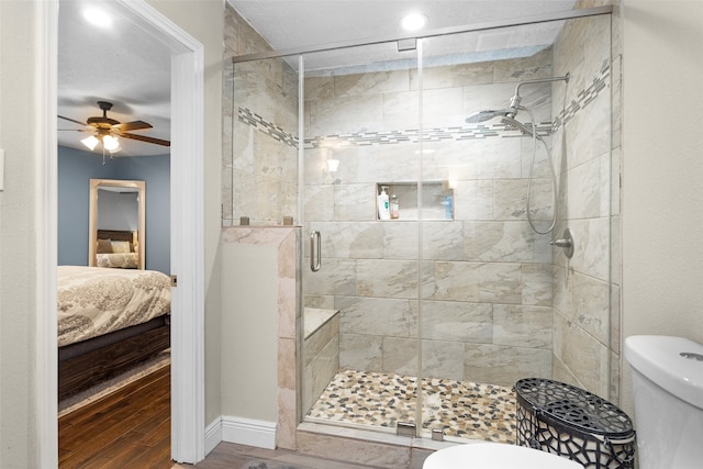 3926 Lavender St, Houston, TX 77026 - ensuite bathroom with wood finished floors, ceiling fan, a stall shower, and recessed lighting