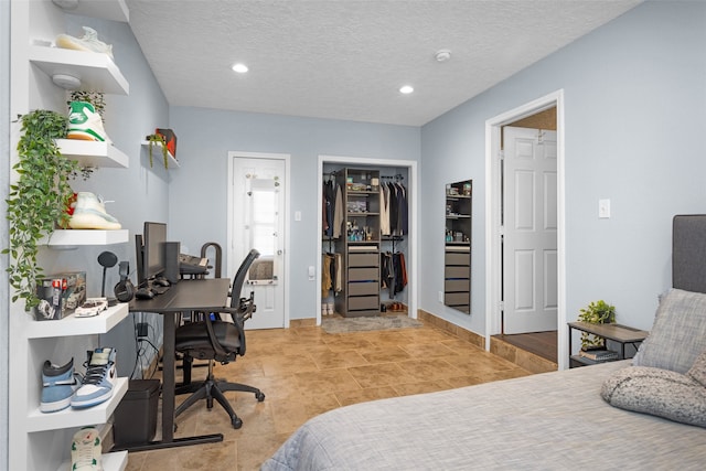 3926 Lavender St, Houston, TX 77026 - bedroom with a desk, recessed lighting, and a textured ceiling