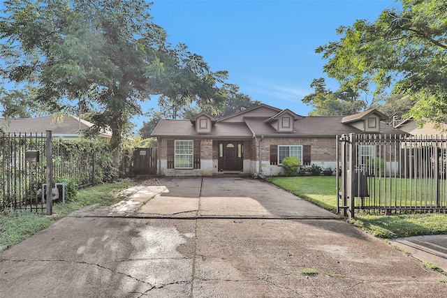 3926 Lavender St, Houston, TX 77026 - view of front of property featuring brick siding, concrete driveway, and a fenced front yard