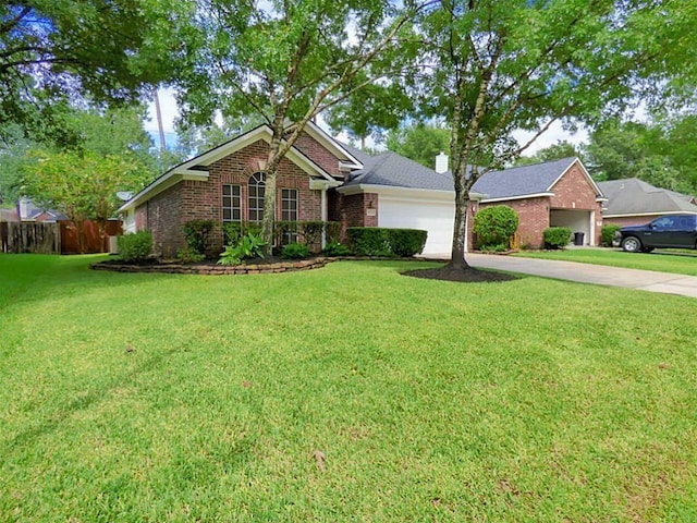 20726 Redbud Trl, Humble, TX 77346 - view of front of house featuring a garage, concrete driveway, brick siding, and a chimney