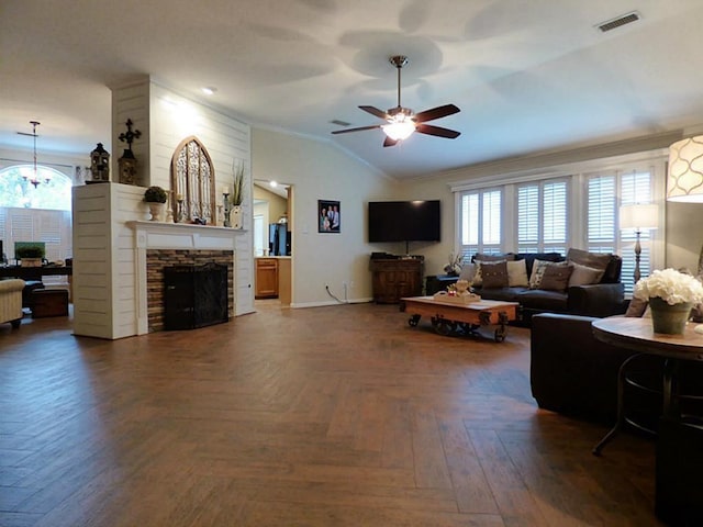 20726 Redbud Trl, Humble, TX 77346 - living room featuring ornamental molding, lofted ceiling, a ceiling fan, plenty of natural light, and a stone fireplace