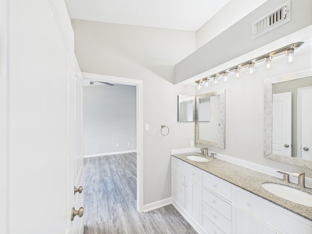 8055 Cambridge St Unit 26, Houston, TX 77054 - bathroom with double vanity and wood finished floors