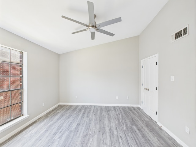 8055 Cambridge St Unit 26, Houston, TX 77054 - spare room featuring light wood finished floors, a ceiling fan, and lofted ceiling