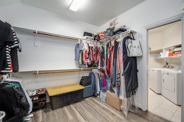 3053 Peterson Cir, Bryan, TX 77802 - walk in closet with washer and dryer and wood finished floors