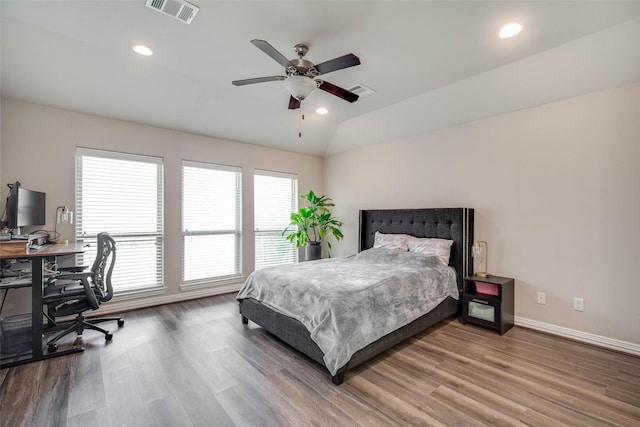 3053 Peterson Cir, Bryan, TX 77802 - bedroom with wood finished floors, an office area, lofted ceiling, recessed lighting, and ceiling fan