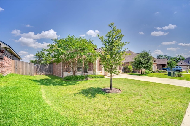3053 Peterson Cir, Bryan, TX 77802 - view of property hidden behind natural elements with driveway and brick siding
