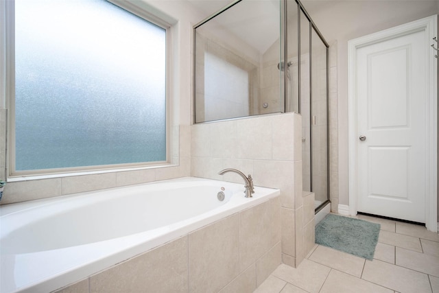 3053 Peterson Cir, Bryan, TX 77802 - full bathroom with a shower stall, plenty of natural light, a garden tub, and tile patterned floors