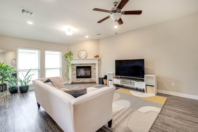 3053 Peterson Cir, Bryan, TX 77802 - living area with a glass covered fireplace, ceiling fan, wood finished floors, and recessed lighting