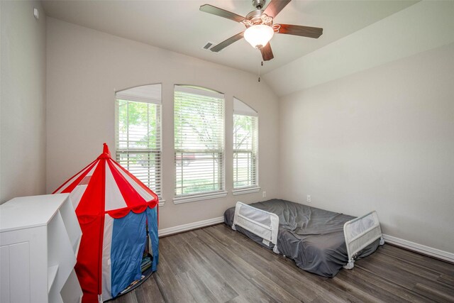 3053 Peterson Cir, Bryan, TX 77802 - unfurnished bedroom with wood finished floors, a ceiling fan, and vaulted ceiling