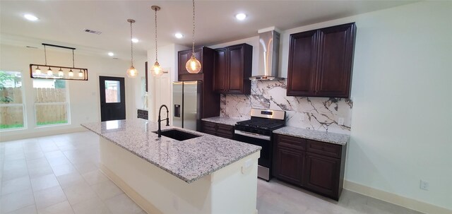 4209 Tampico Rd, Houston, TX 77016 - kitchen featuring stainless steel appliances, wall chimney exhaust hood, backsplash, light stone counters, and recessed lighting